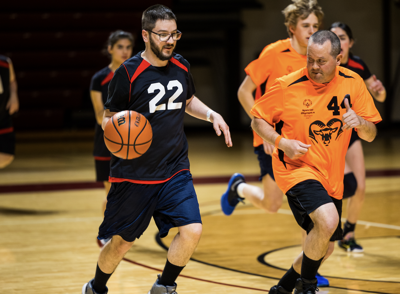 athletes playing basketball