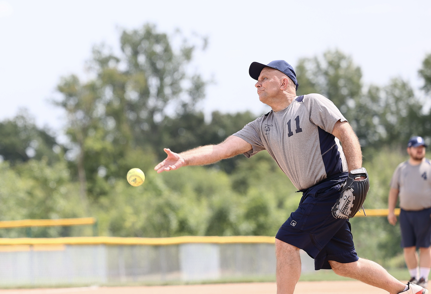 athlete throwing a softball